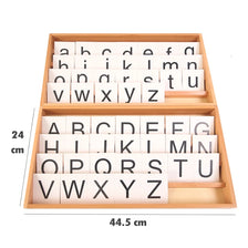 A wooden Montessori alphabet box containing letter cards for the English alphabet.