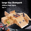 A large size skateboard park set for children with ramps and boards made of light brown wood or plastic.