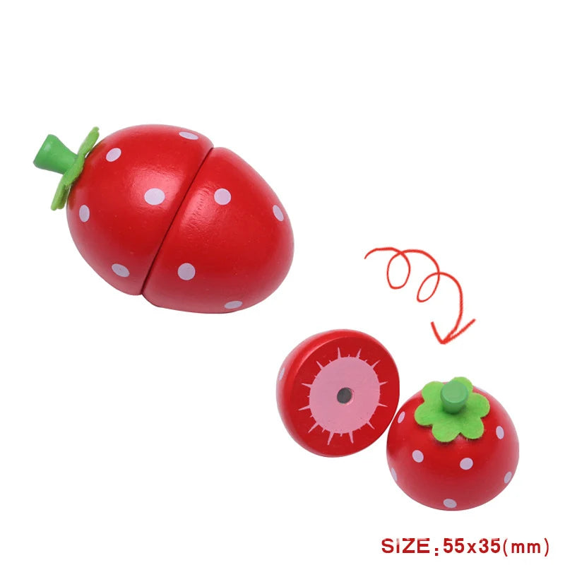 A set of magnetic wooden fruit and vegetable cutting toys, including a strawberry and a tomato.