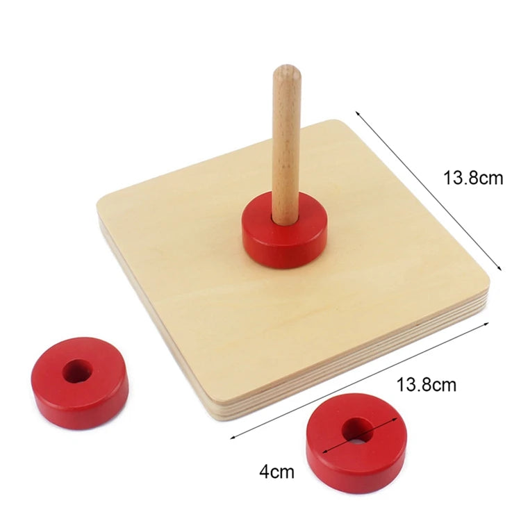 A wooden sensory toy set featuring a pink wooden peg and corresponding red discs for toddlers.