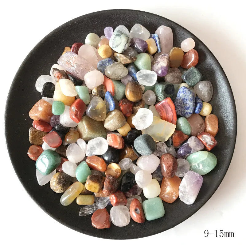 A collection of natural mixed quartz crystal stones in various colors and shapes.