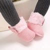 Pink plush baby snow boots for girls and boys with fuzzy trim and anti-slip soles