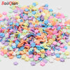 A pile of colorful soft polymer clay slices assorted for nail art and DIY crafts