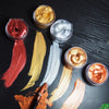 Metallic gold acrylic paint in various shades and textures displayed for crafts and DIY projects