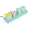 A set of colorful wooden Montessori sensory blocks stacked in various shapes and sizes.