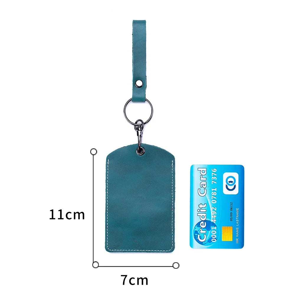 A teal leather key wallet with a card holder attached to a strap, shown against a white background.