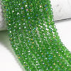 Green faceted crystal glass beads strung together in a strand