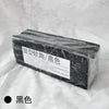 A rectangular block of black professional soft polymer clay for sculpting and doll making