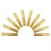 A set of ten bamboo clarinet reeds are arranged in a semi-circle, showing various strengths from 2 to 2.5.