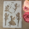 A sheet of white stencil featuring various silhouette designs of fairies and winged figures for crafting.