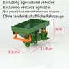 A green agricultural vehicle model, likely a tractor or trailer, is shown with various dimensions marked.