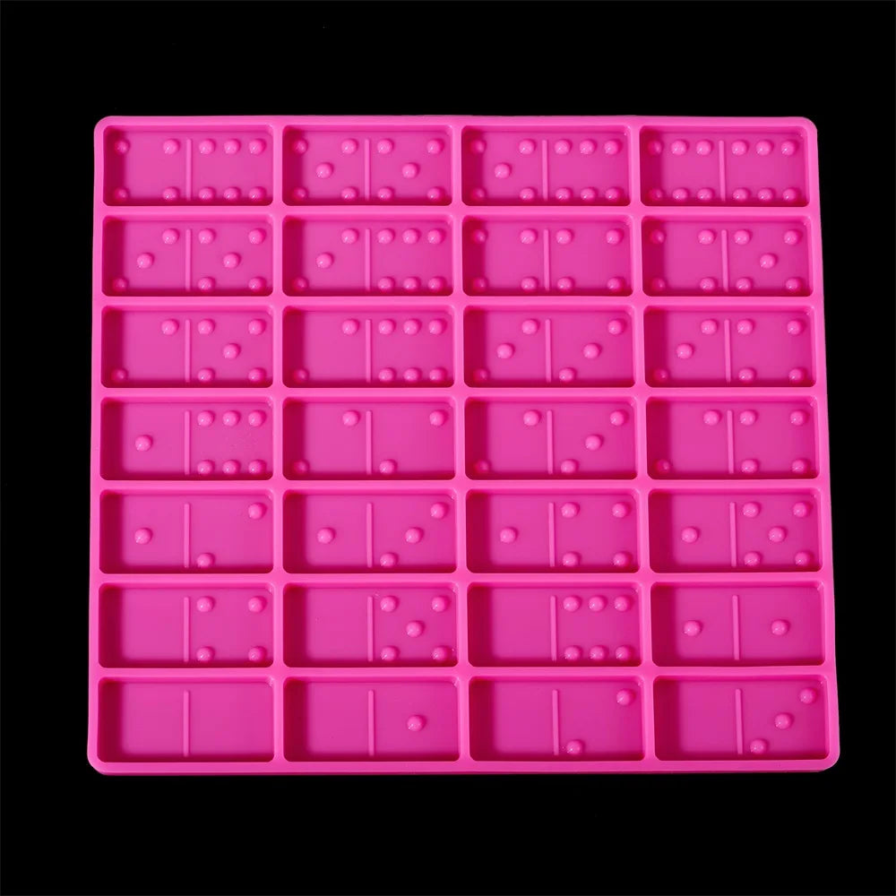 A pink silicone mold set for making dominoes in epoxy resin jewelry