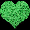 A heart shape filled with bright green cylindrical polymer clay candy sprinkles for cake decorating