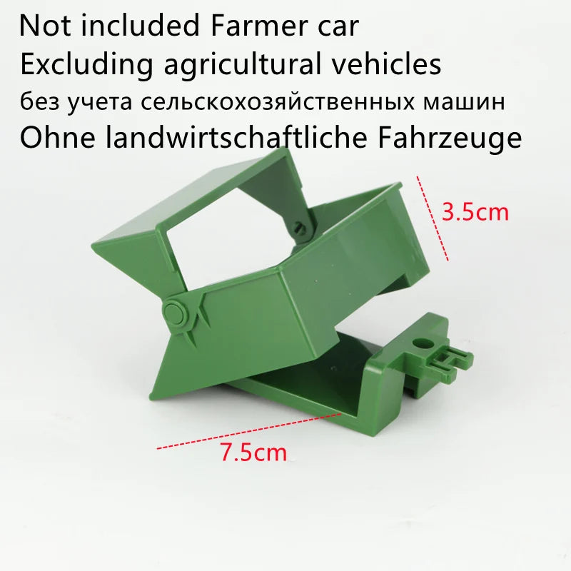 A green plastic tractor attachment for a remote control vehicle, showing various sized parts.