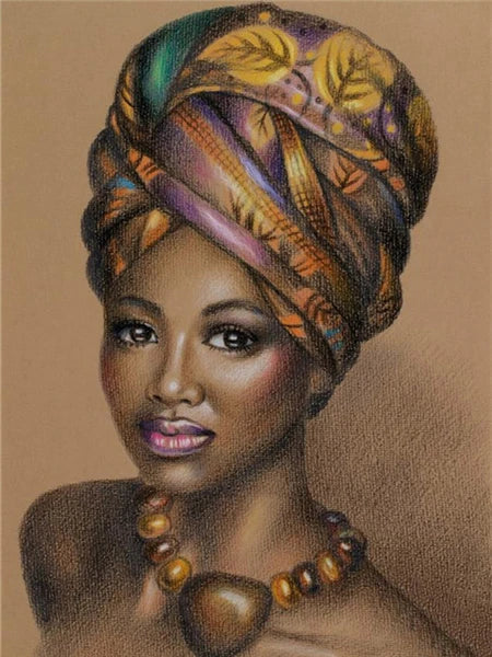 A portrait of a beautiful Black woman wearing a patterned headwrap and gold necklace.