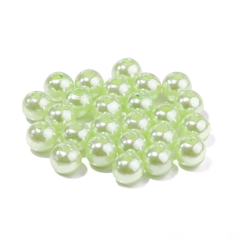 A cluster of small, pale green imitation pearl beads for DIY jewelry making