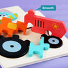 A set of colorful wooden puzzle pieces shaped like cartoon animals, including a red elephant and other figures.