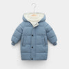 A light blue kids' padded parka jacket with a cream sherpa hood displayed on a hanger.