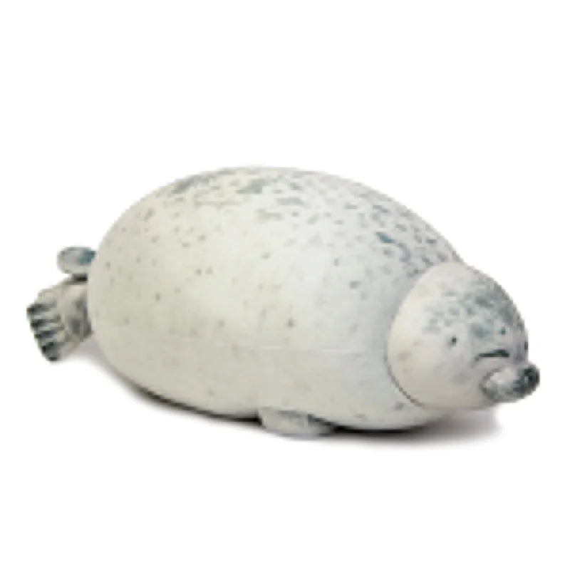 A white seal plush toy with light blue spots, resting on a white background.