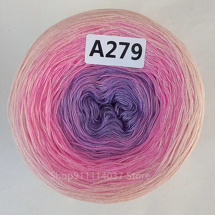 A spool of pink and purple rainbow gradient mercerized cotton cake yarn labeled A279