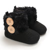 A pair of black plush baby snow boots with faux fur trim and anti-slip soles.