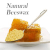 A spoonful of natural beeswax is shown on a white plate, next to a piece of solidified beeswax.