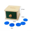 A wooden sensory toy set featuring a light wood box with a green window and blue circular discs.