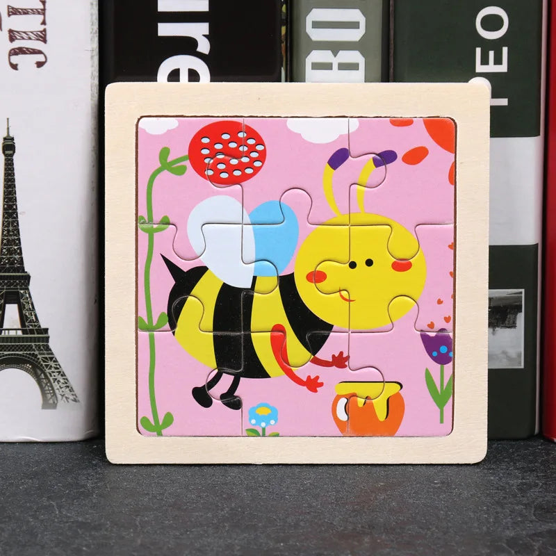 A wooden tangram puzzle featuring a yellow bee design on a pink background.