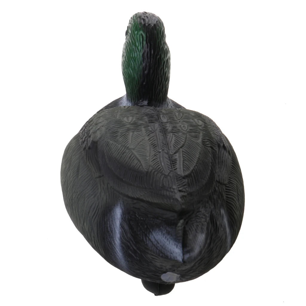A dark green and black floating duck decoy with a keel, shown from the back.