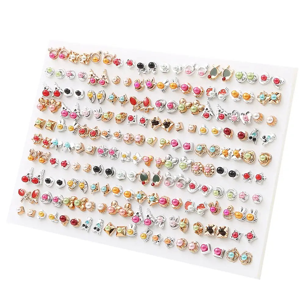 A display of assorted acrylic stud earrings featuring hearts, stars, and moons in various colors and styles.