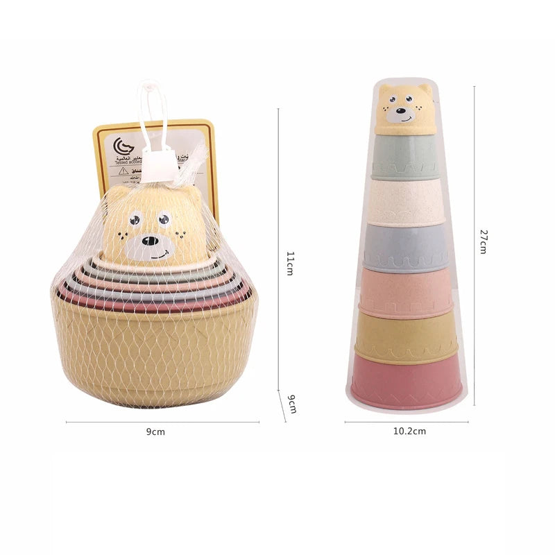 A set of boat-shaped stacking cups bath toys for toddlers in various pastel colors and textures.