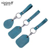 A teal leather key wallet featuring a card holder and attached leather strap.