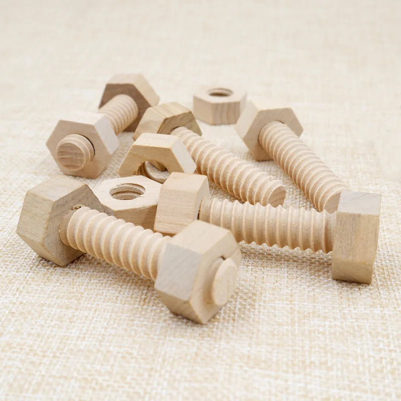 Wooden screw and nut building blocks made of light wood stacked on a beige fabric surface.