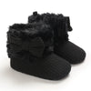 Black plush baby snow boots for girls and boys with a fuzzy trim and anti-slip sole