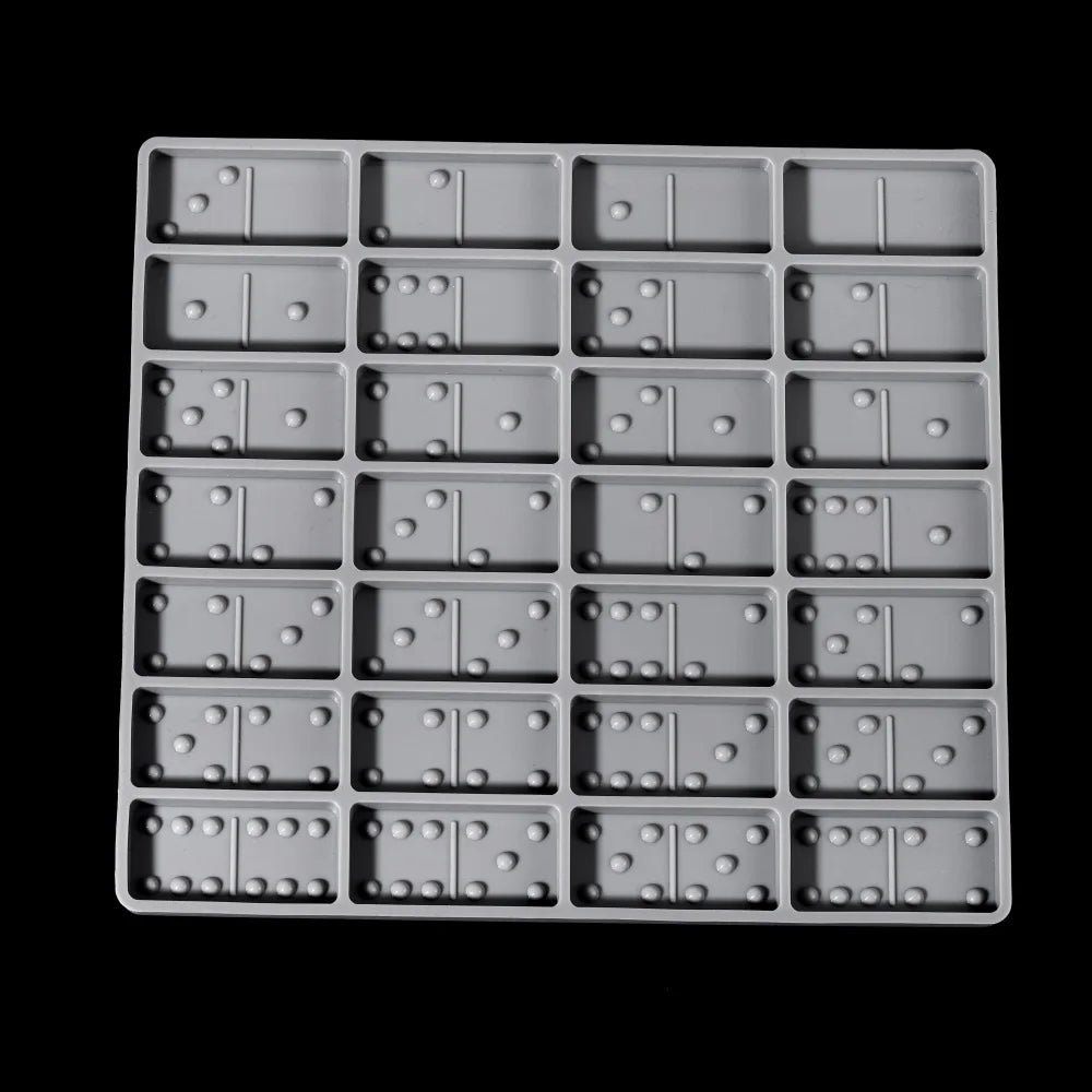 A silicone mold set for dominoes used in epoxy resin jewelry making, featuring multiple small molds.
