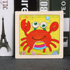 A wooden puzzle featuring a bright orange crab design on a yellow background.