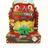A DinoTrux dinosaur truck toy car with removable dinosaur figures displayed in its packaging.