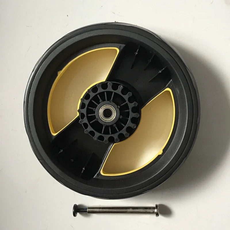 A black circular product with a yellow rim and a central mechanism, accompanied by a small metal rod.