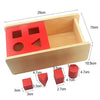 A wooden Montessori sensory toy set featuring a red tray with various shaped wooden blocks and a wooden box.