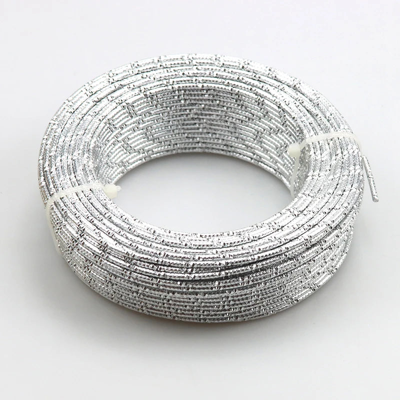 A coil of silver-colored flexible aluminum craft wire used for jewelry making and DIY projects.
