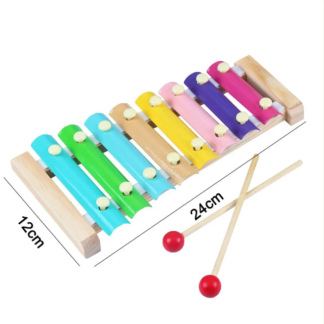 Wooden sensory blocks in various colors and sizes with attached music rattles