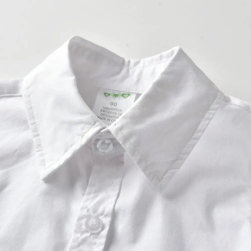 White boys' formal wedding outfit set including a shirt with a collar tag