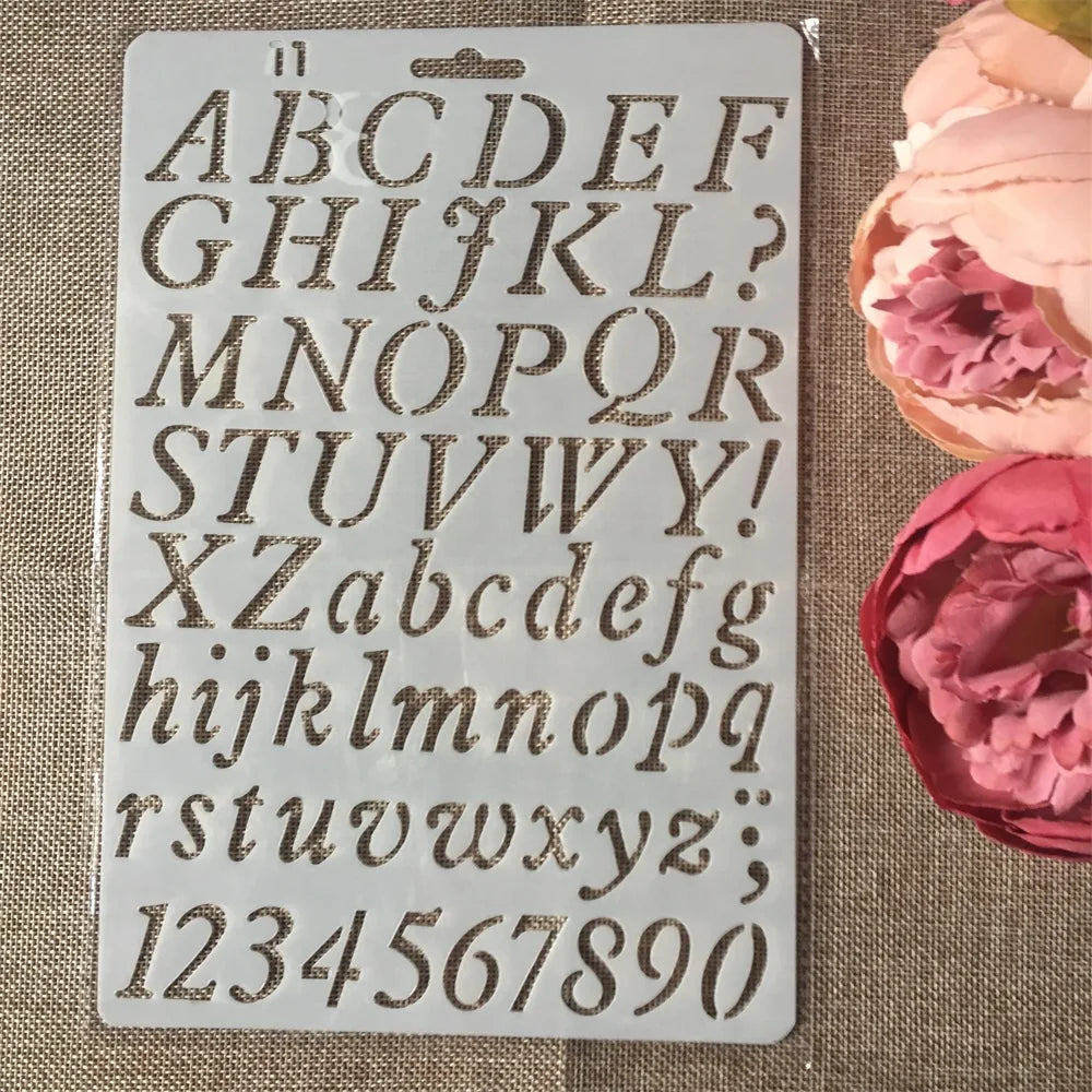 A white stencil sheet showing uppercase and lowercase letters and numbers for crafting