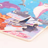 A collection of wooden cartoon animal jigsaw puzzles featuring various sea creatures and fish.