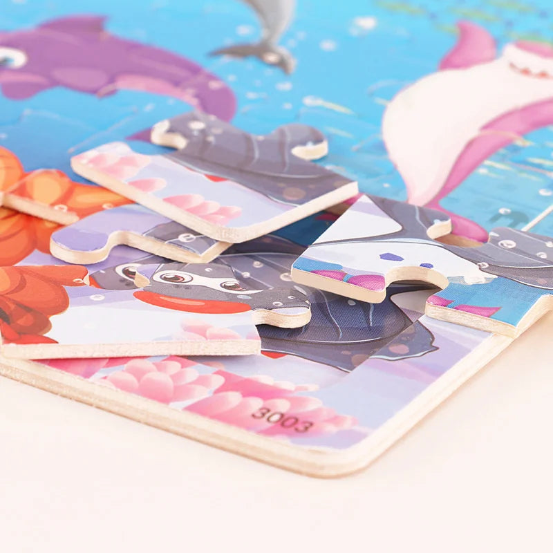 A collection of wooden cartoon animal jigsaw puzzles featuring various sea creatures and fish.