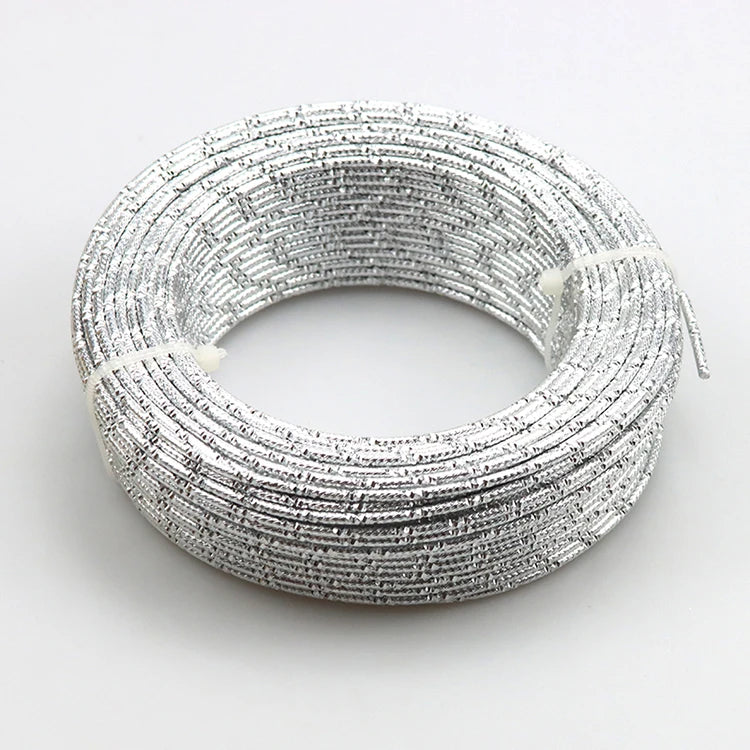 A coil of silver-colored flexible aluminum craft wire for jewelry making and DIY projects.