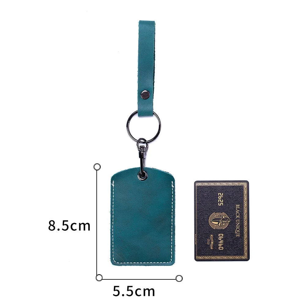 A teal leather key wallet with a card holder and a matching leather strap.