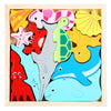 A wooden 3D puzzle board featuring colorful cartoon animals and fruit shapes for toddlers.