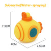 Yellow cartoon soft rubber bath toy shaped like a vehicle or animal with an orange spray top.