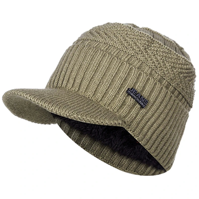 Olive green knit beanie with a brim and faux fur trim